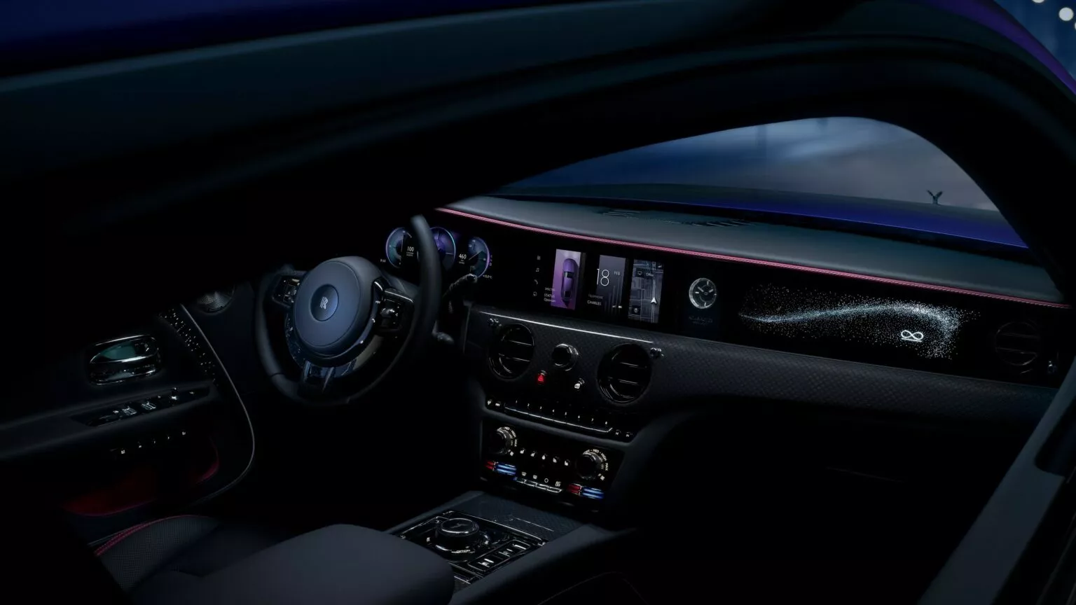 2025 Rolls-Royce Spectre Black Badge in beweging. 2025 Rolls-Royce Spectre Black Badge in beweging.